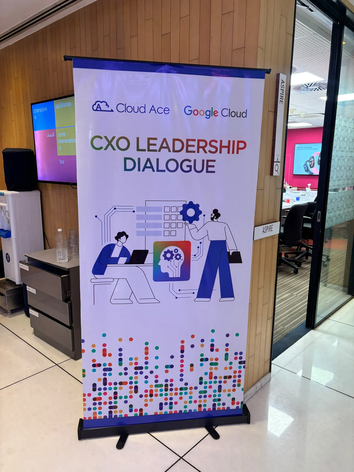 The CXO Leadership Dialogue banner, co-branded by Cloud Ace and Google Cloud, standing in the corridor outside the meeting room