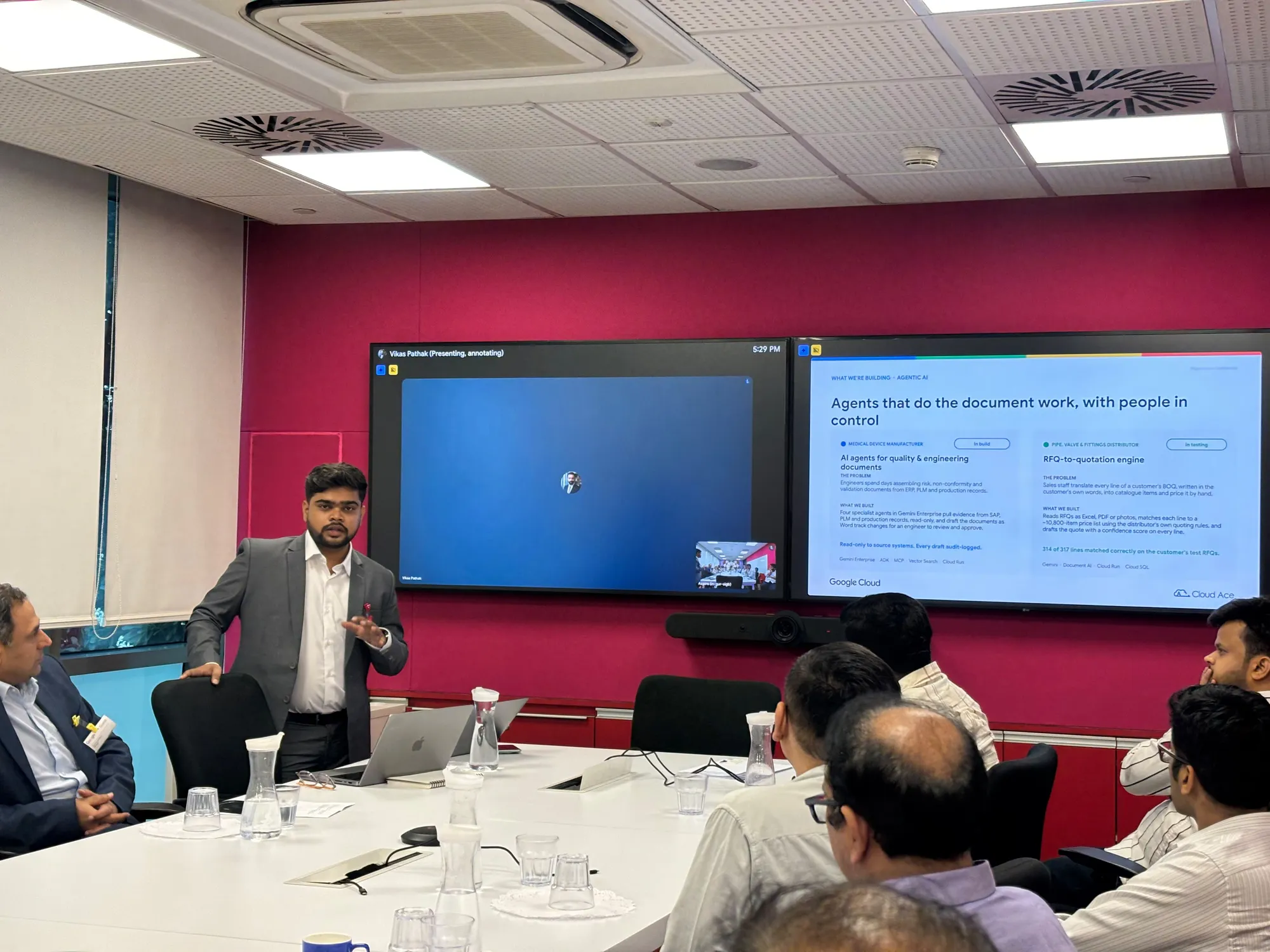 A presenter speaking beside a screen during the Cloud Ace session on taking enterprise AI from pilot to production